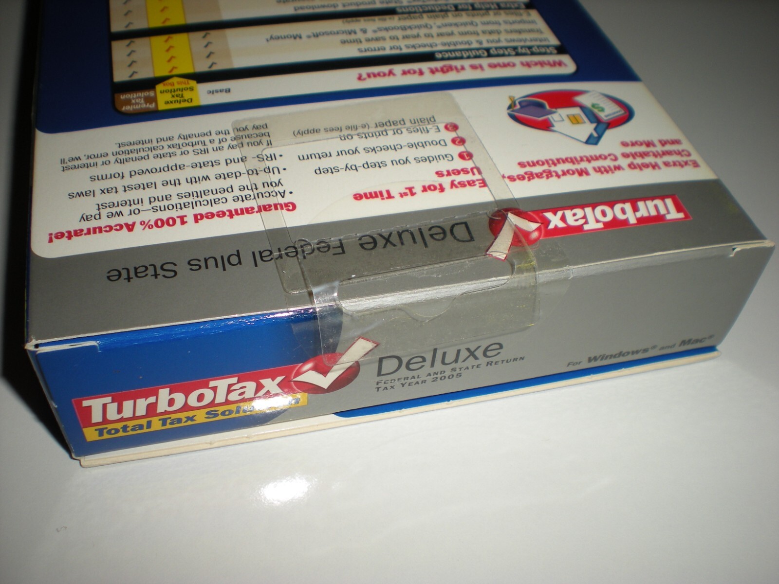 Turbotax 2005 Deluxe + state. New in box. Genuine but blemished package.